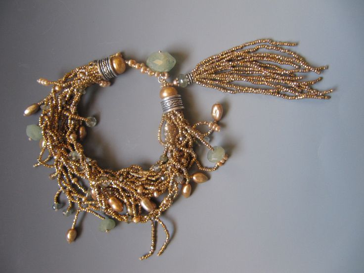Bracelet of braided antique French brass seed beads, silver .