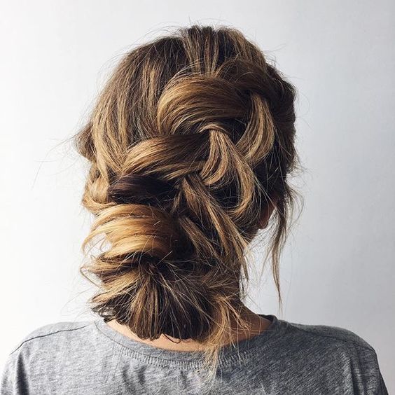 a casual messy braided low updo with bangs is ideal for those .