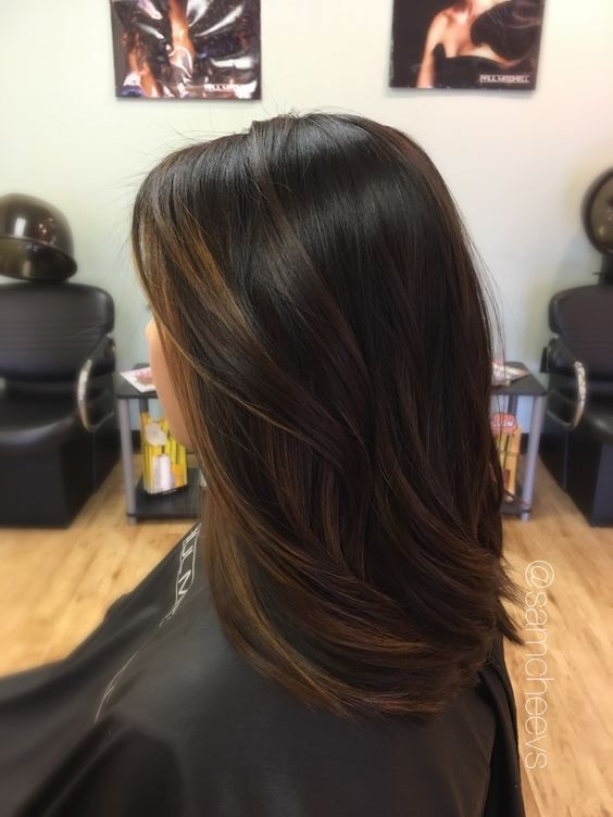 black hair with subtle brown balayage is a chic idea to add .