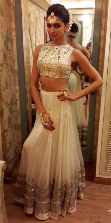 Deepika wearing a Arpita Mehta mirror work crop top and lehenga .