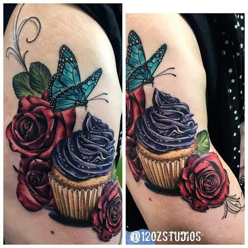 Adorable and colorful cupcake tattoo featuring roses and butterfly .