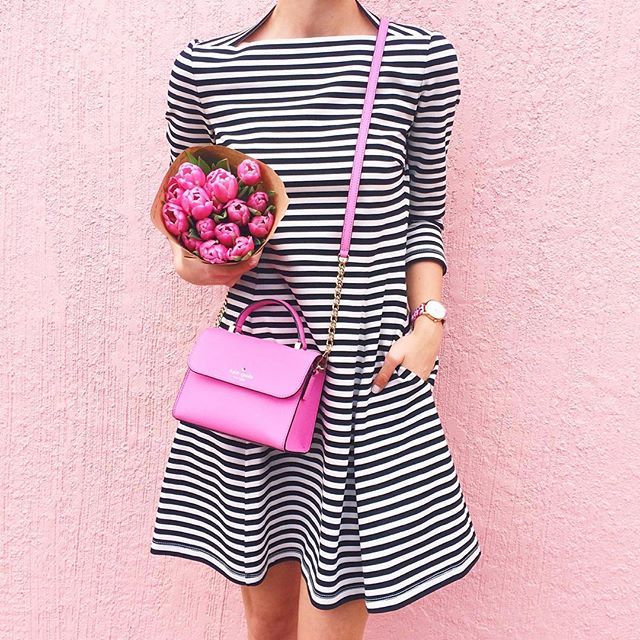 Cutest striped dress for spring with a cute pink handbag .