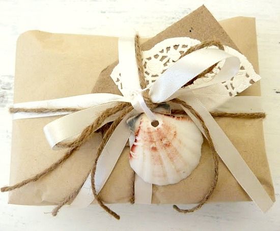 Simple Beachy Gift Wrapping Ideas with Shells, Brown Paper & Twine .