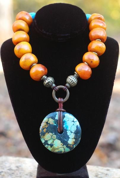 Soul Of Tibet Copal Amber and Turquoise Donut Pendant Necklace .