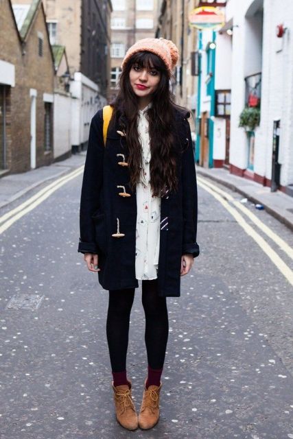 With white dress, black tights, brown ankle boots and pastel color .