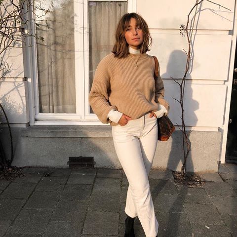 Tan knit sweater over white turtleneck and pants. | Fashion .