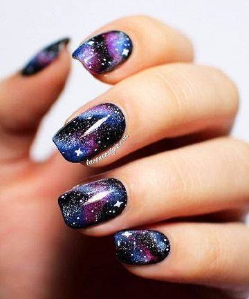 Galaxy-Inspired Glittery Nails
   Design