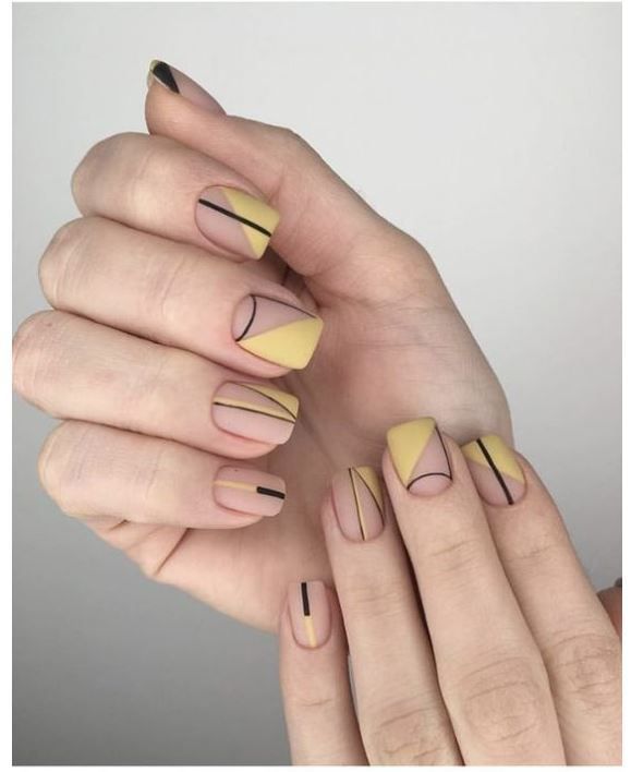 Geometric Gold Striped Nails
     