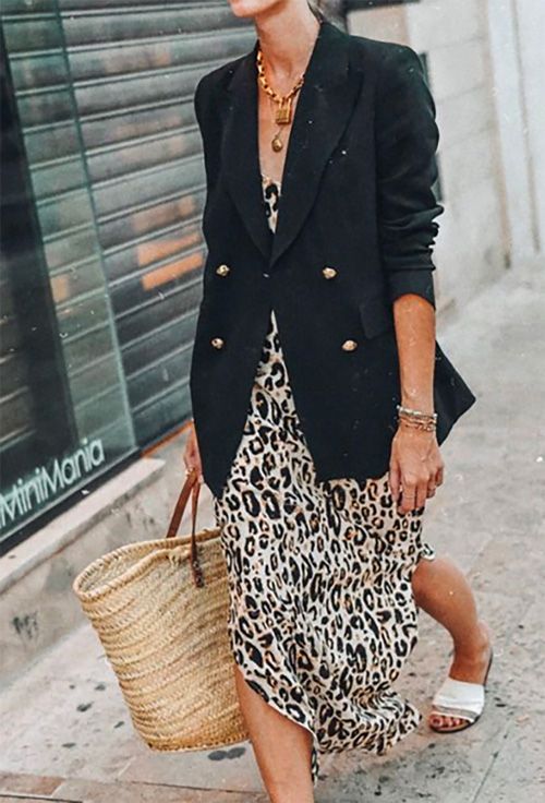 Leopard-print slip dress with black blazer, basket bag, and slides .