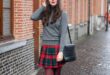 With gray turtleneck, marsala tights, ankle boots, red beret and .