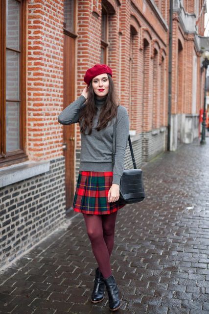 With gray turtleneck, marsala tights, ankle boots, red beret and .