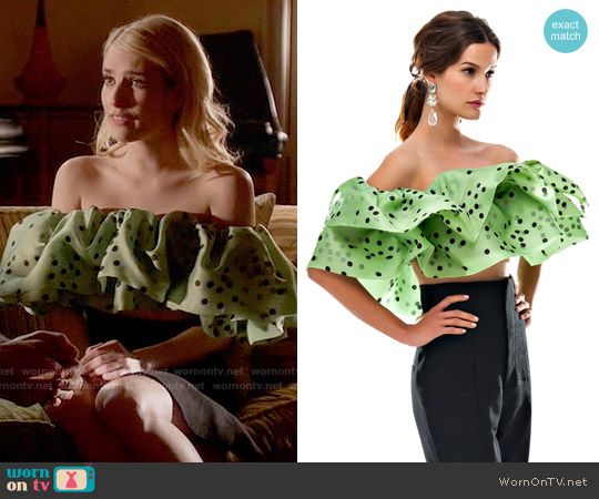 Chanel's green polka dot off-shoulder top on Scream Queens .