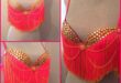 Neon Pink Fringed bra top with gold chains and rhinestones comes .