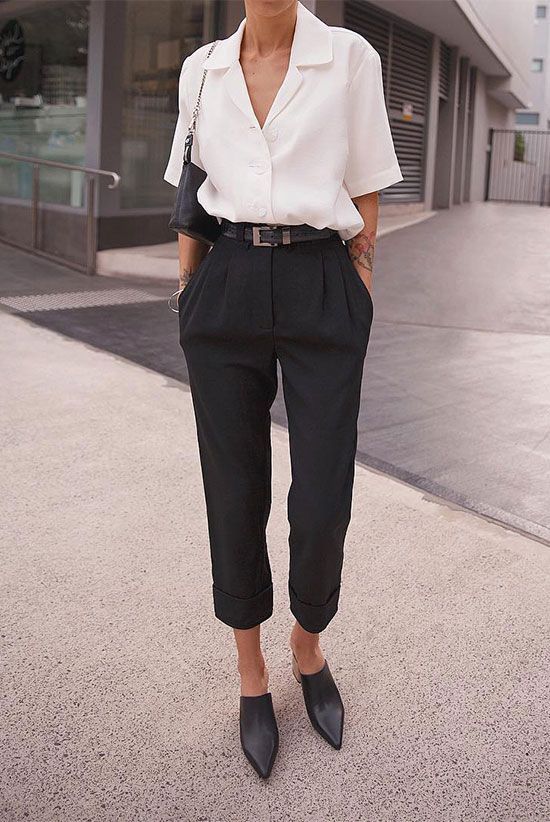 pepamack wearing a white short sleeve shirt, black high waist .