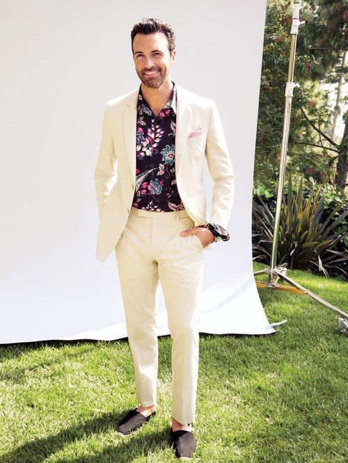 a cremay suit, black espadrilles and a moody floral shirt, which .