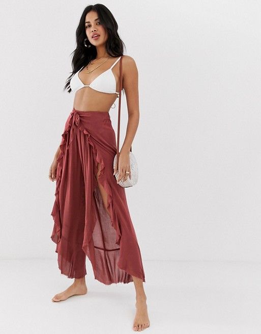 ASOS DESIGN ruffle split front beach trousers with tie waist .