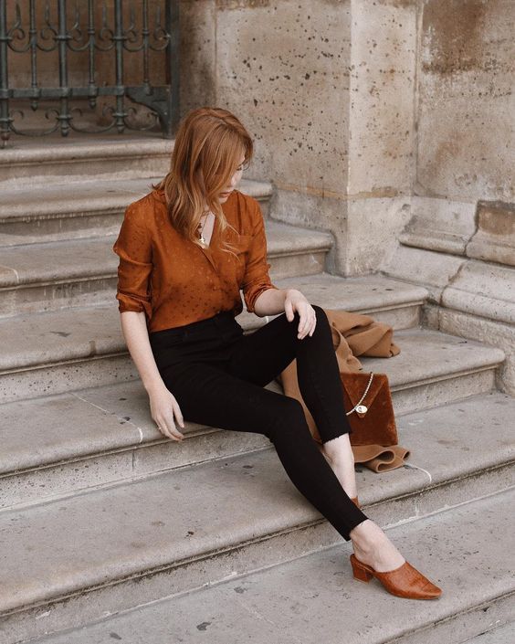 a gorgeous retro inspired look with black cropped skinnies, a rust .