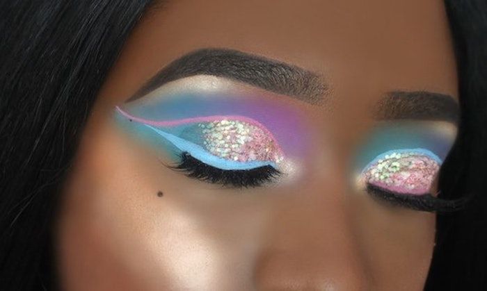 unicorn makeup, with iridescent glitter, and light pink and blue .
