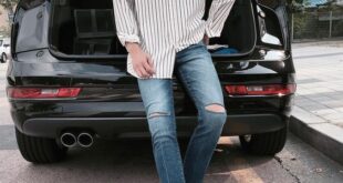 white Vans sneakers, distressed jeans, a loose striped shirt for a .